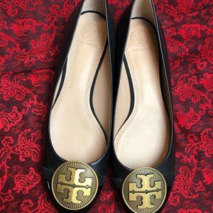Black leather Tory Burch flats with medallion